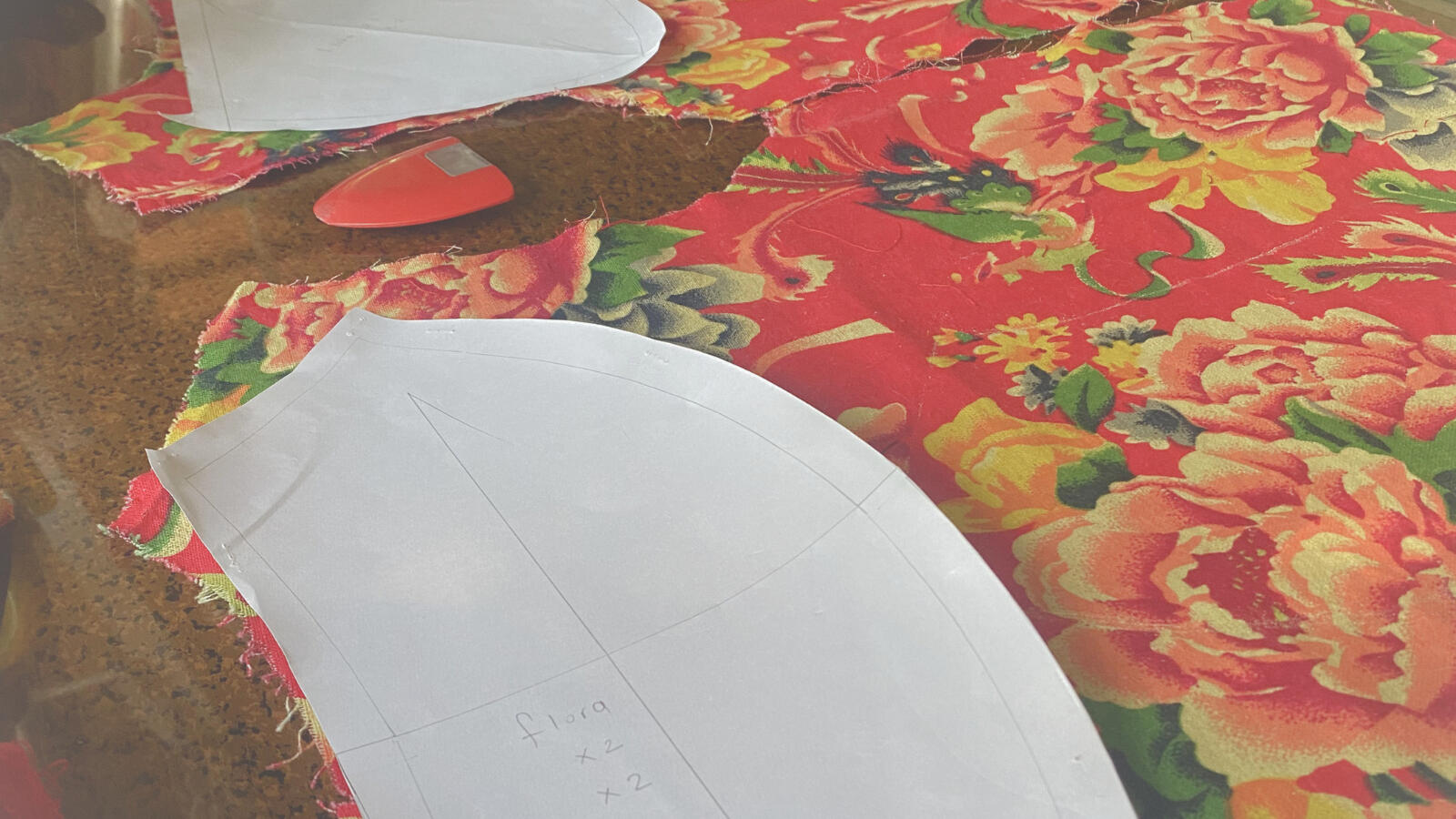 WHERE BALANCE FORMS Pattern pieces, fabric fragments, and garment components used to construct a circular textile cushion.